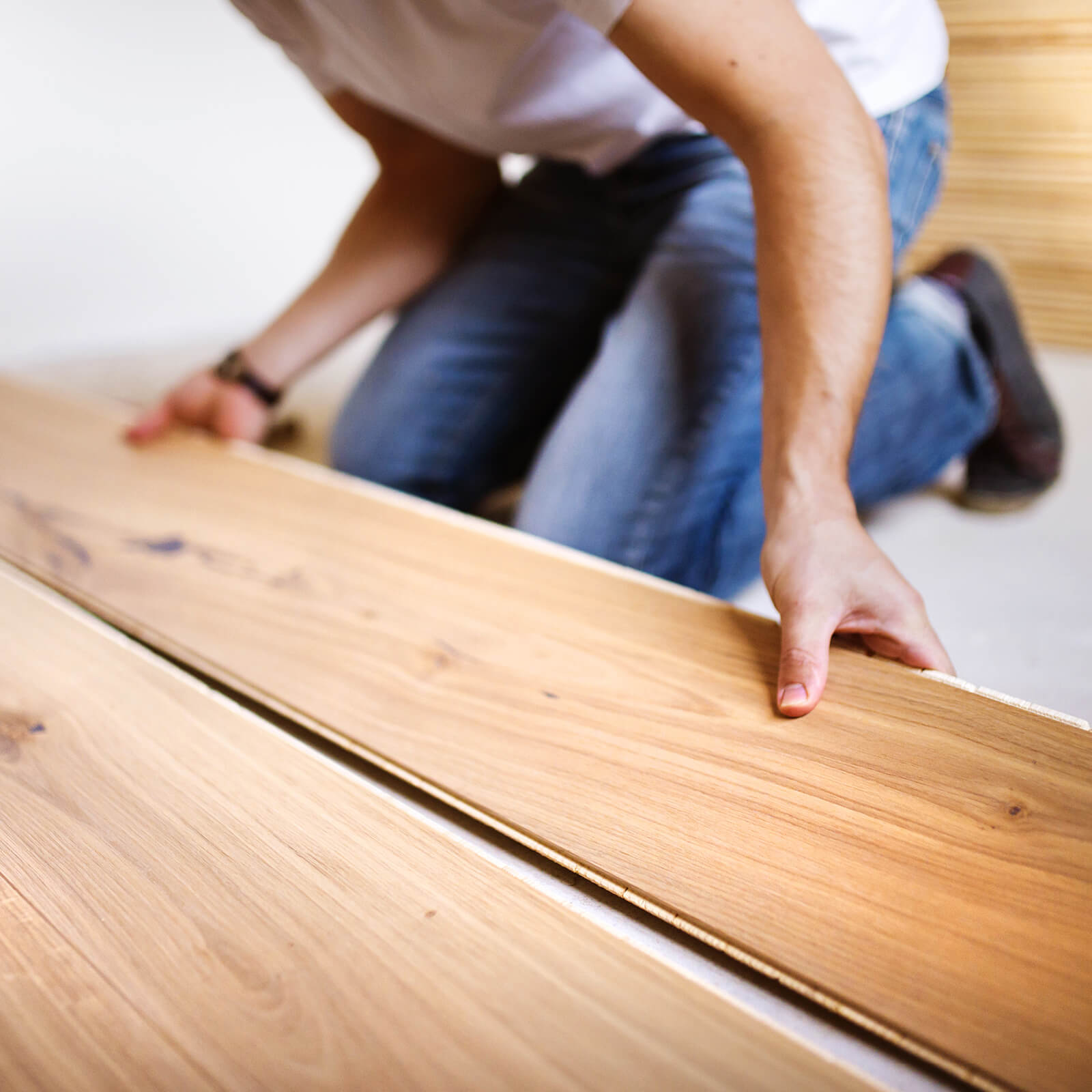 Worker installing tile | Rayo Wholesale